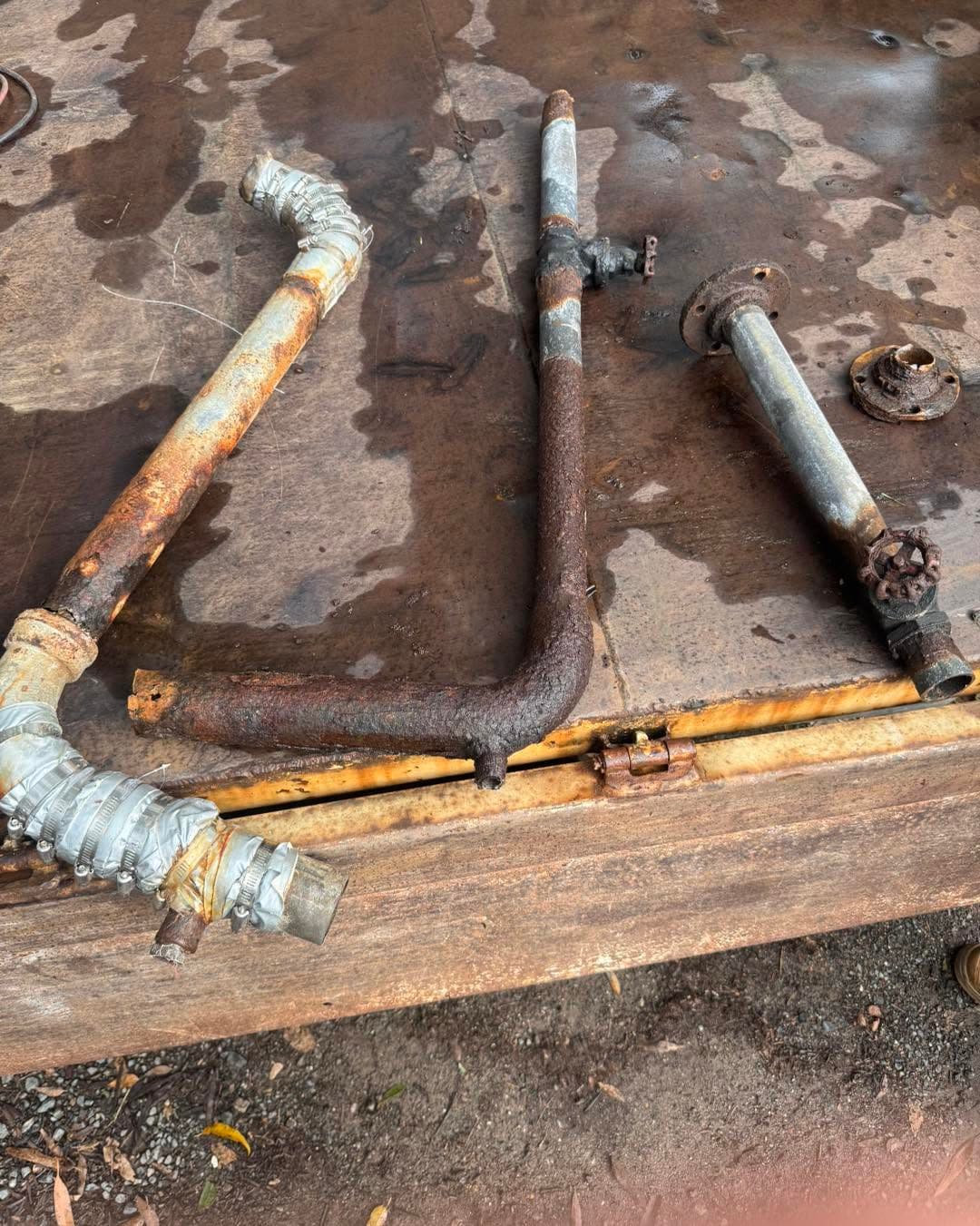 Old corroded pipework exposed during a repair
