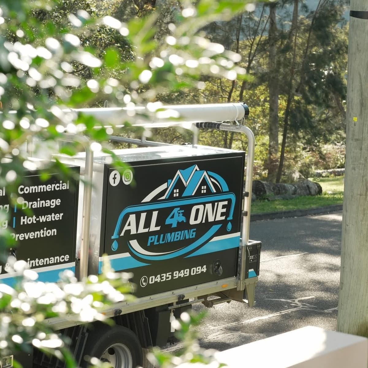 The Plumber Western Sydney truck parked on a leafy street